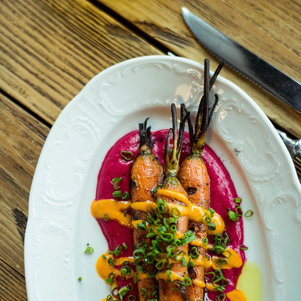 Chef preparing fresh local ingredients in a restaurant kitchen